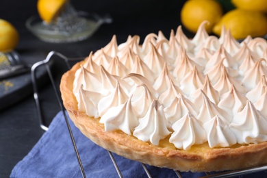 Delicious lemon meringue pie on table, closeup