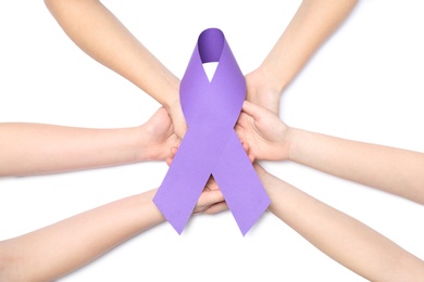 People holding purple awareness ribbon on white background, top view