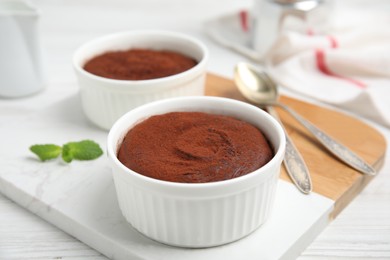 Delicious fresh chocolate fondant on white wooden table