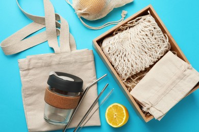 Flat lay composition with eco friendly products on light blue background