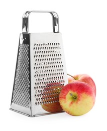 Stainless steel grater and fresh apples on white background