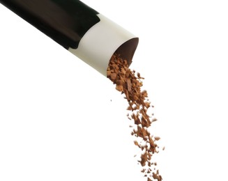 Pouring aromatic instant coffee from sachet on white background