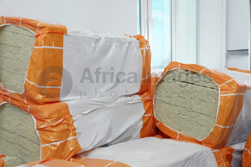 Packages of thermal insulation material in room
