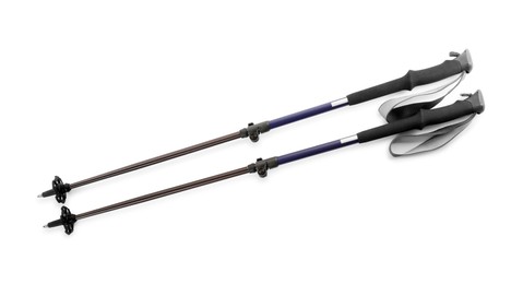 Pair of trekking poles on white background, top view. Camping tourism