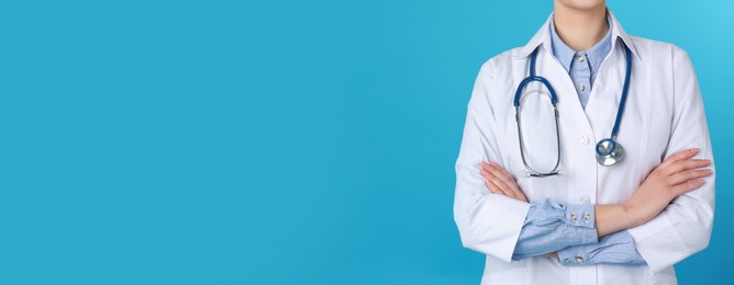 Doctor with stethoscope on turquoise background, closeup view and space for text. Banner design