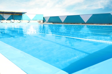 Outdoor swimming pool on sunny summer day