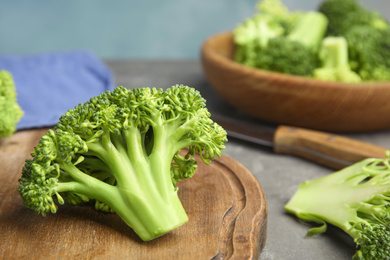 Fresh green broccoli on grey table, closeup. Organic food