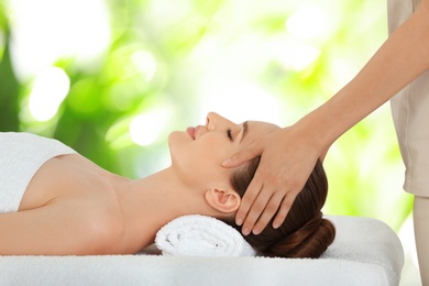 Beautiful young woman enjoying massage. Spa treatment