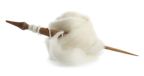 Ball of combed wool with wooden spindle isolated on white