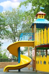 New colorful castle playhouse with slide on children's playground