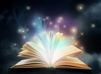 Open book with fairytales and magic lights. Creative design