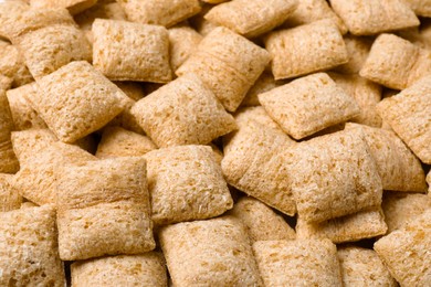 Delicious crunchy corn pads as background, closeup