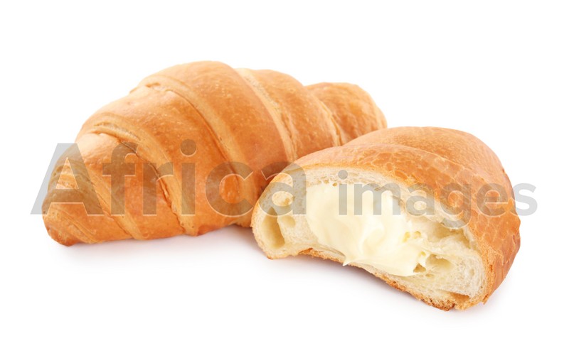Photo of Delicious croissants with cream on white background