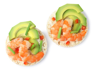 Puffed rice cakes with shrimps and avocado isolated on white, top view