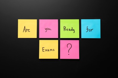 Black chalkboard with phrase Are You Ready For Exams made of stickers as background