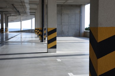 Empty open car parking garage on sunny day
