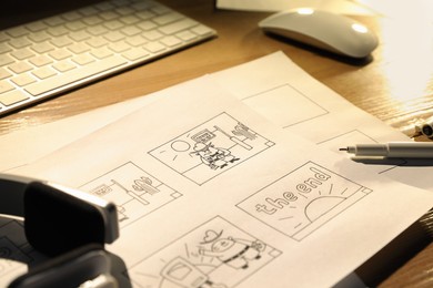 Storyboard with cartoon sketches at workplace. 	
Pre-production process