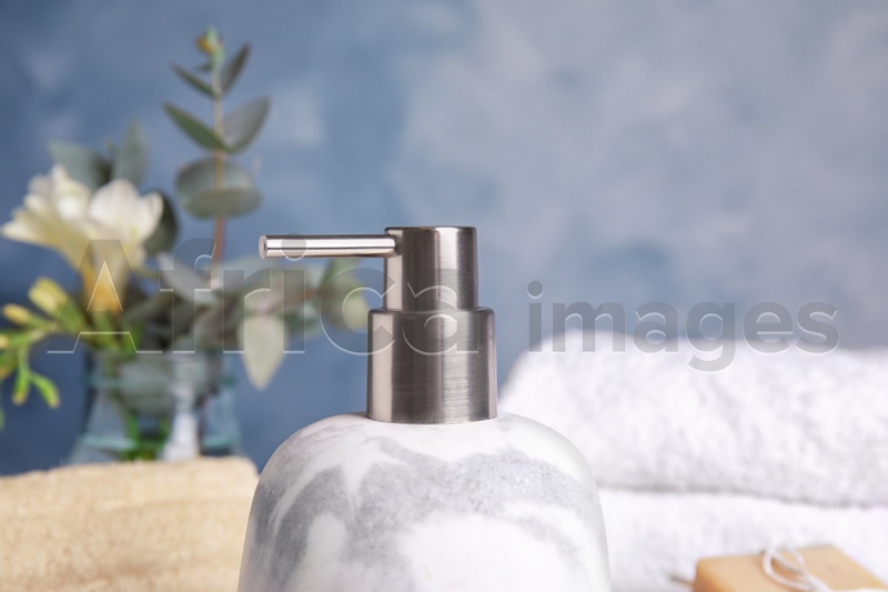 Modern marble soap dispenser in bathroom, closeup