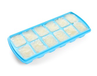Cauliflower puree in ice cube tray isolated on white