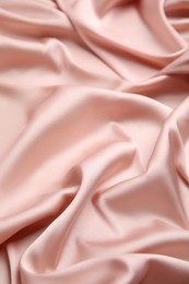 Texture of delicate pink silk as background, closeup